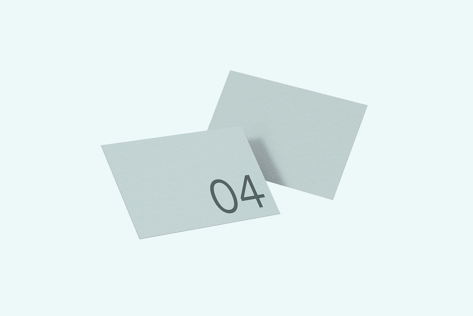 Two blank cards mockup with a minimalist design suitable for print mockups and graphic design projects, showcasing card layout and paper texture.