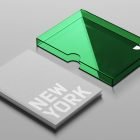 Mockup of a gray book titled New York with a green transparent plastic case. Ideal for packaging mockups. Sleek and modern design.