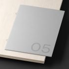 Magazine print mockup on a wooden surface suitable for graphic designers. Perfect for print mockup category. High-quality PSD file for design presentations.