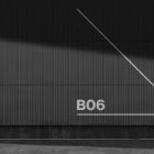 Black corrugated metal wall texture with diagonal lines and B06 text suitable for billboard mockup designs for graphic designers SEO keywords billboard mockup.