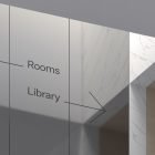 Modern interior signage with arrows pointing to rooms and library. Minimalist design mockup, ideal for graphic designers seeking print or billboard mockups.