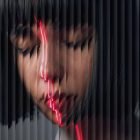 Image of a person with artistic distortion effect red neon lines on face reflecting Photoshop effects digital asset for graphic designers creative projects