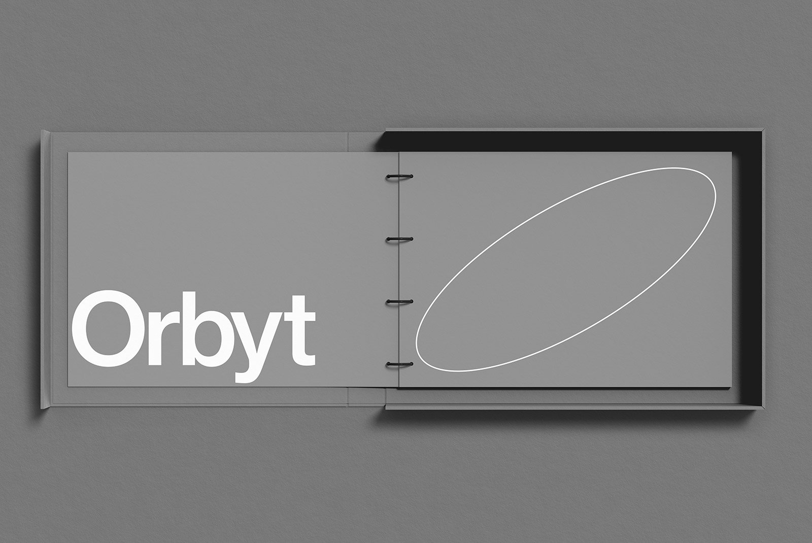 Elegant open booklet mockup on grey background for print designs, showcasing modern typography and minimalist graphics, ideal for graphic designers and branding projects.