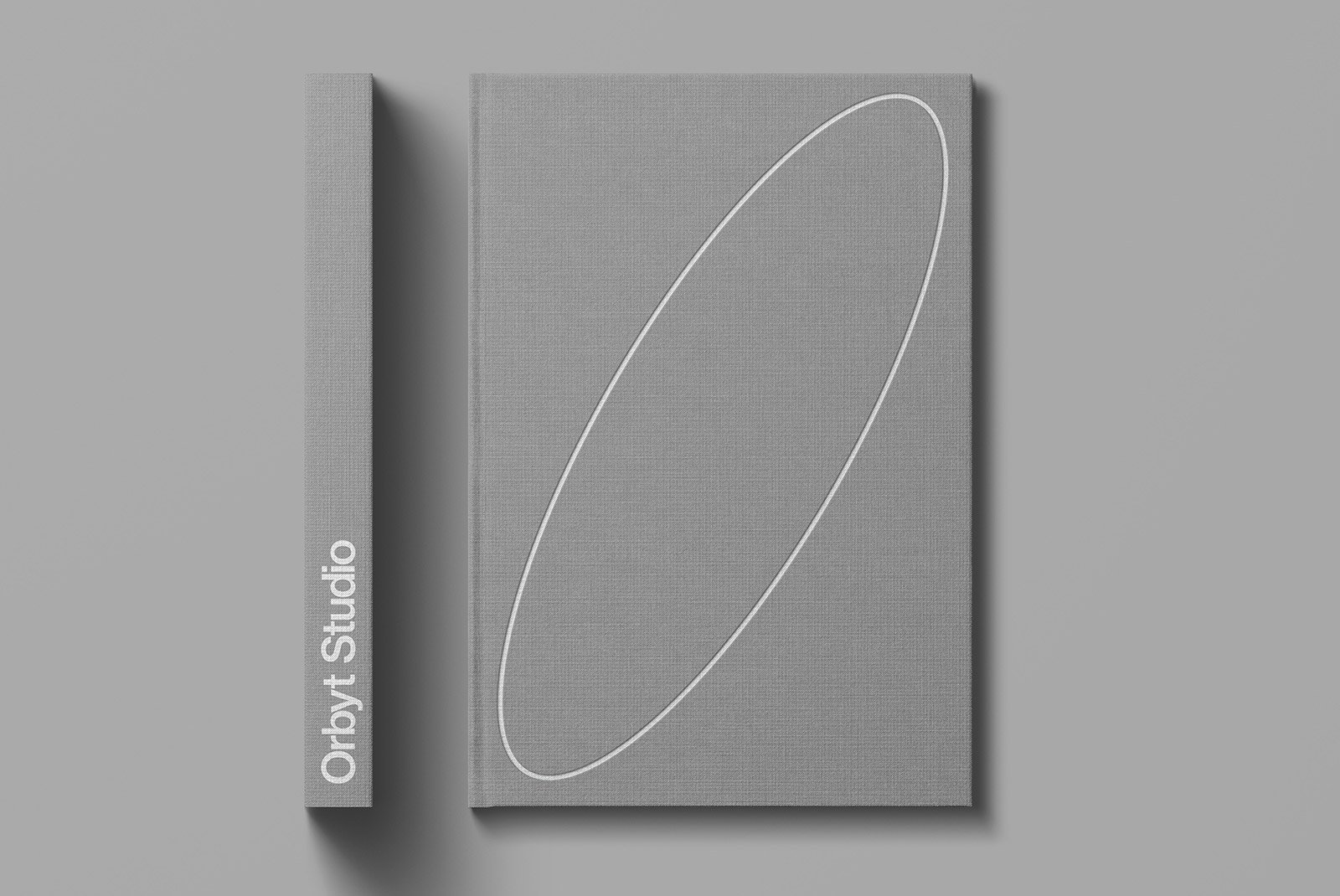 Hardcover book mockup with gray cloth cover featuring minimalist design. Ideal for graphic designers looking for print mockups packaging mockups or editorial designs.