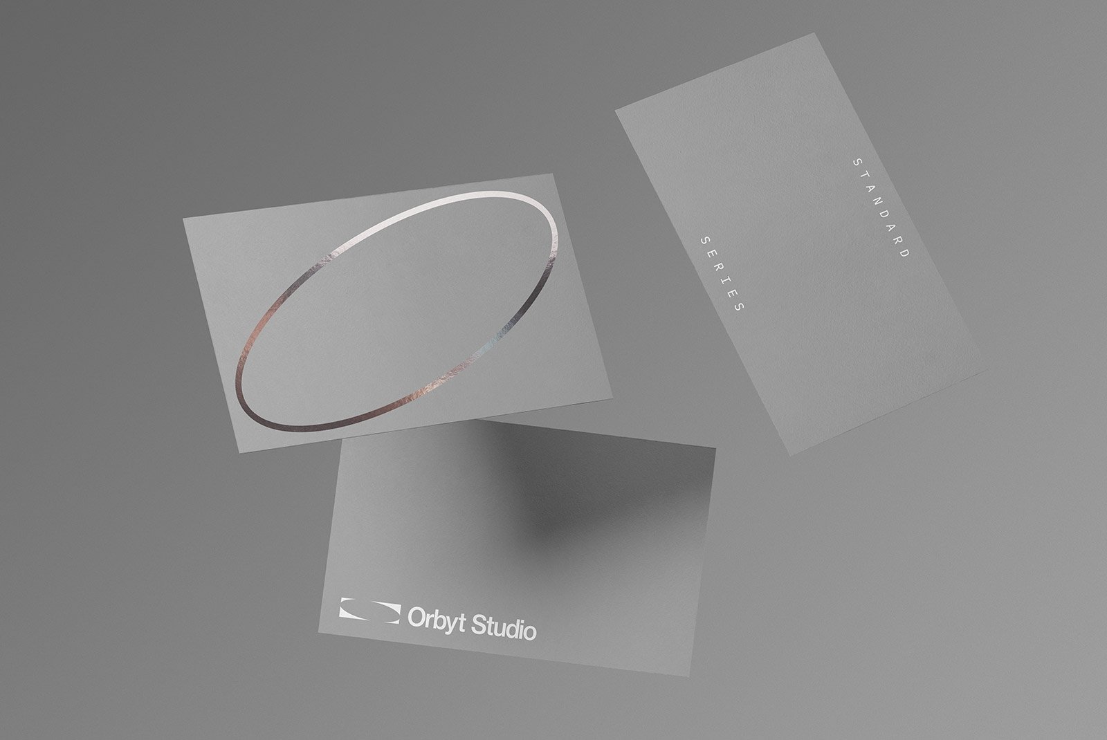 Minimalist business card mockups floating against a gray background perfect for graphic designers seeking elegant print mockup templates and graphic resources.