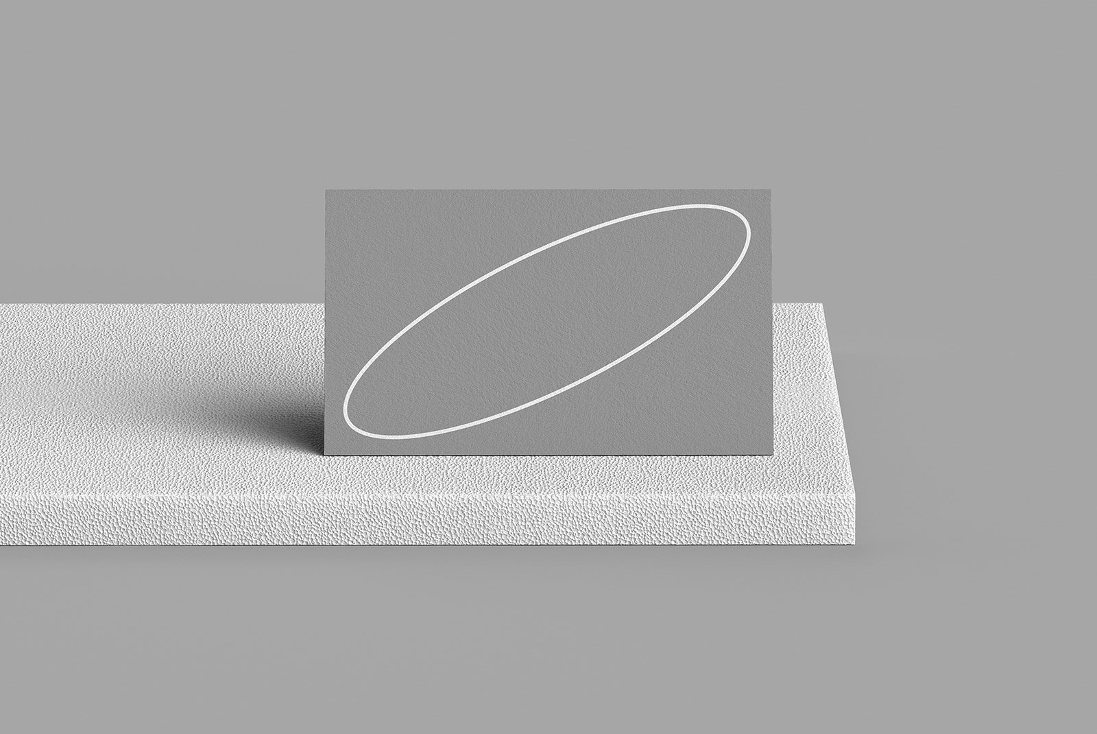 Gray cardstock square on textured white pedestal suitable for print mockups for graphic designers digital assets SEO keywords: print mockup, graphic design.