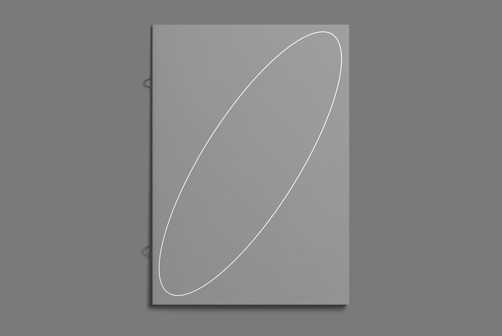 Gray notebook mockup with a single white oval design for graphic designers. Ideal for print mockups, packaging mockups, and branded stationery visualizations
