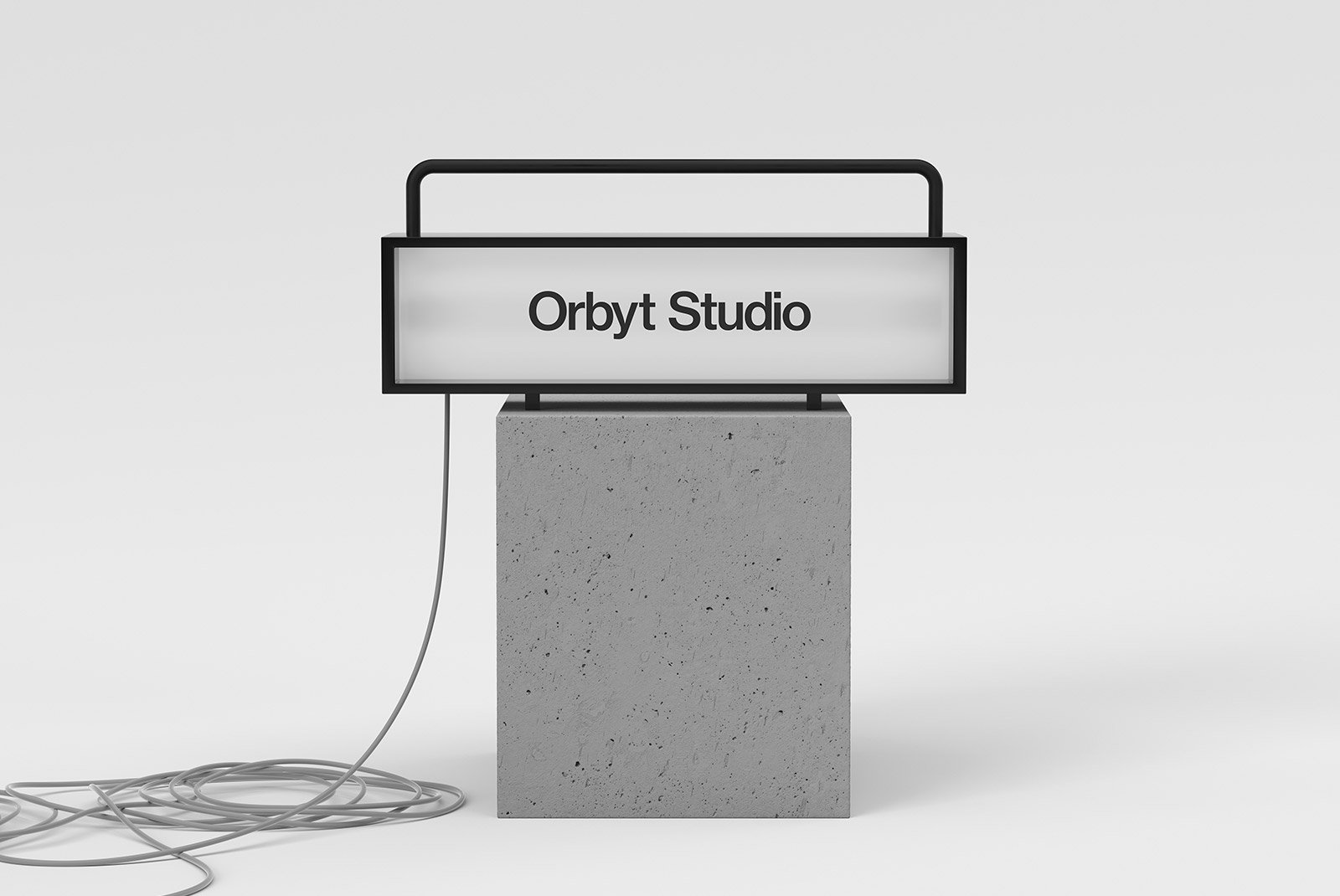Billboard mockup featuring a rectangular illuminated sign displaying Orbyt Studio mounted on a concrete base with a coiled cable, ideal for graphic designers.
