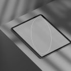 Black tablet placed on a gray surface in a minimalist setting digital product tech mockup graphic design resource for designers showcasing interfaces.