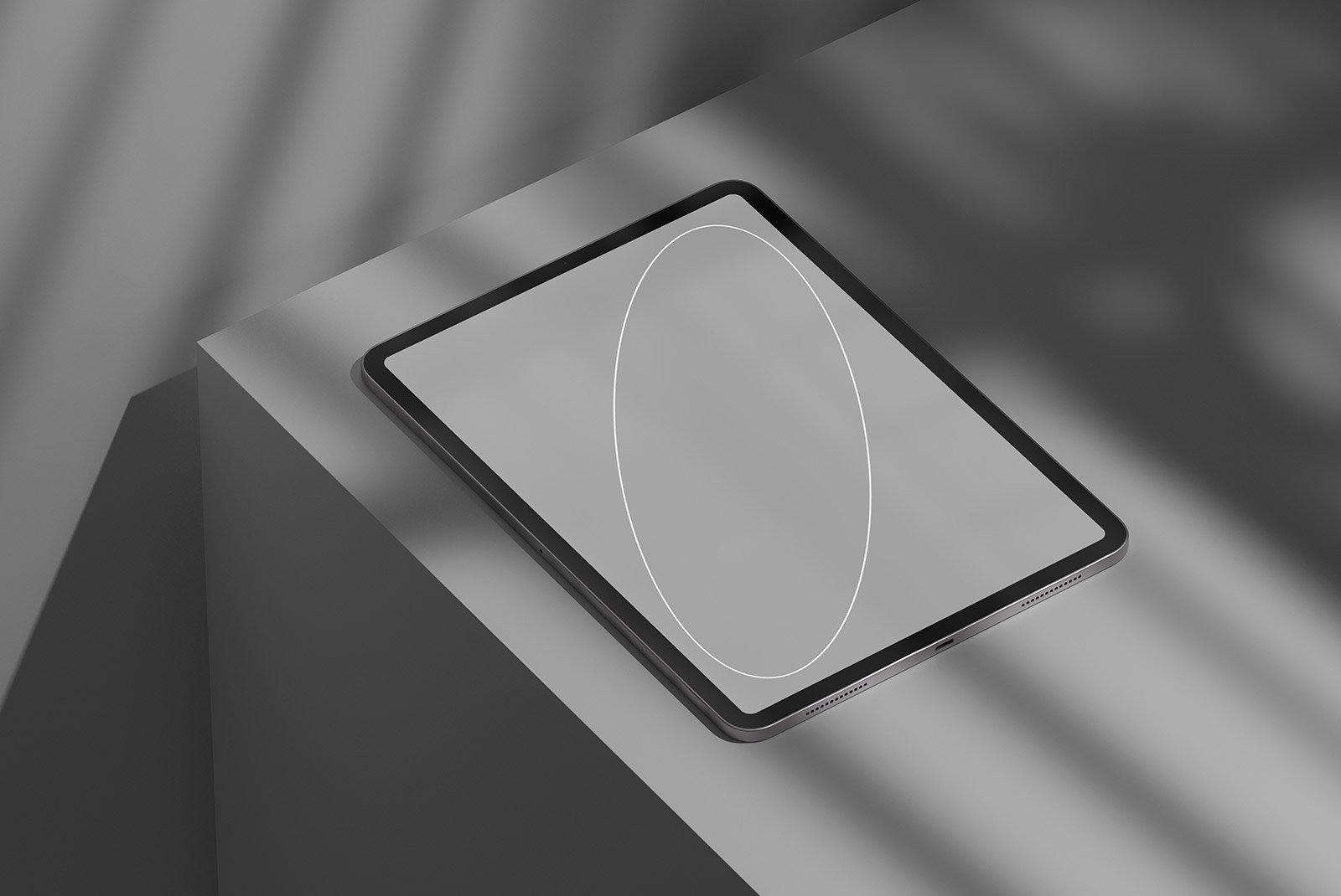 Black tablet placed on a gray surface in a minimalist setting digital product tech mockup graphic design resource for designers showcasing interfaces.