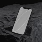 Smartphone mockup on rugged rock surface perfect for tech mockups themes digital assets for graphic designers phone presentation realistic showcase.