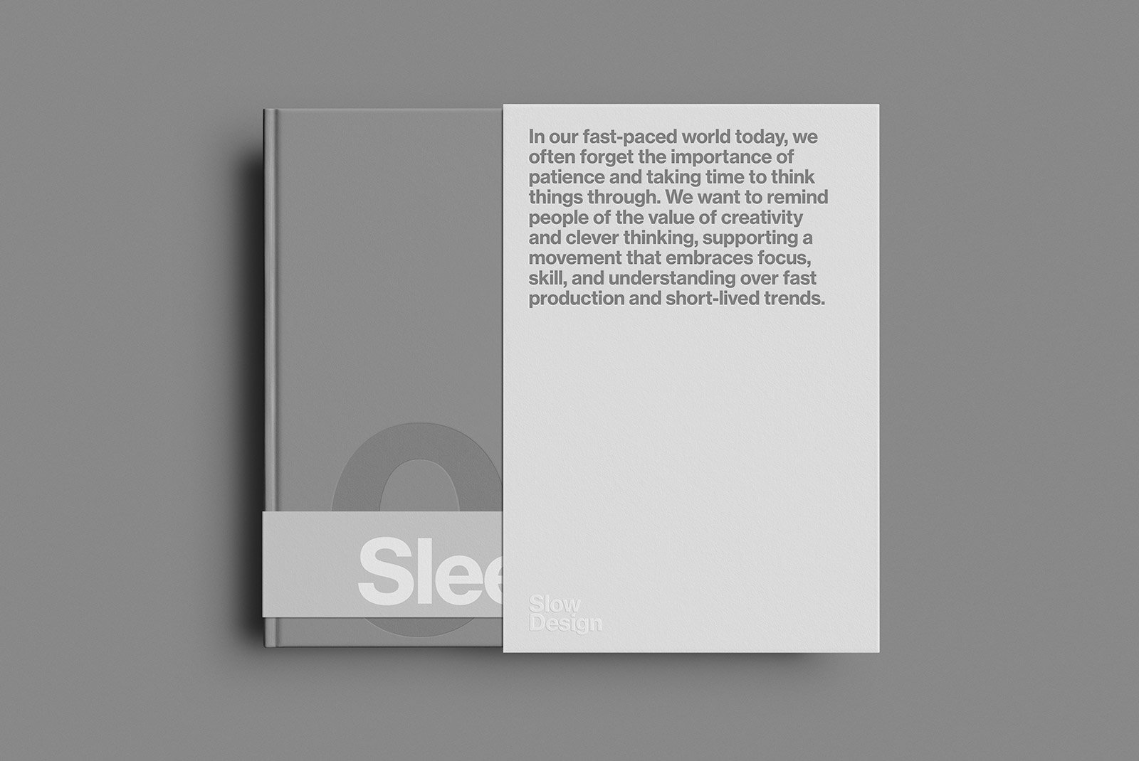 Hardcover book print mockup with minimalist design featuring a grey cover and white band displaying text. Ideal for graphic and print designers.