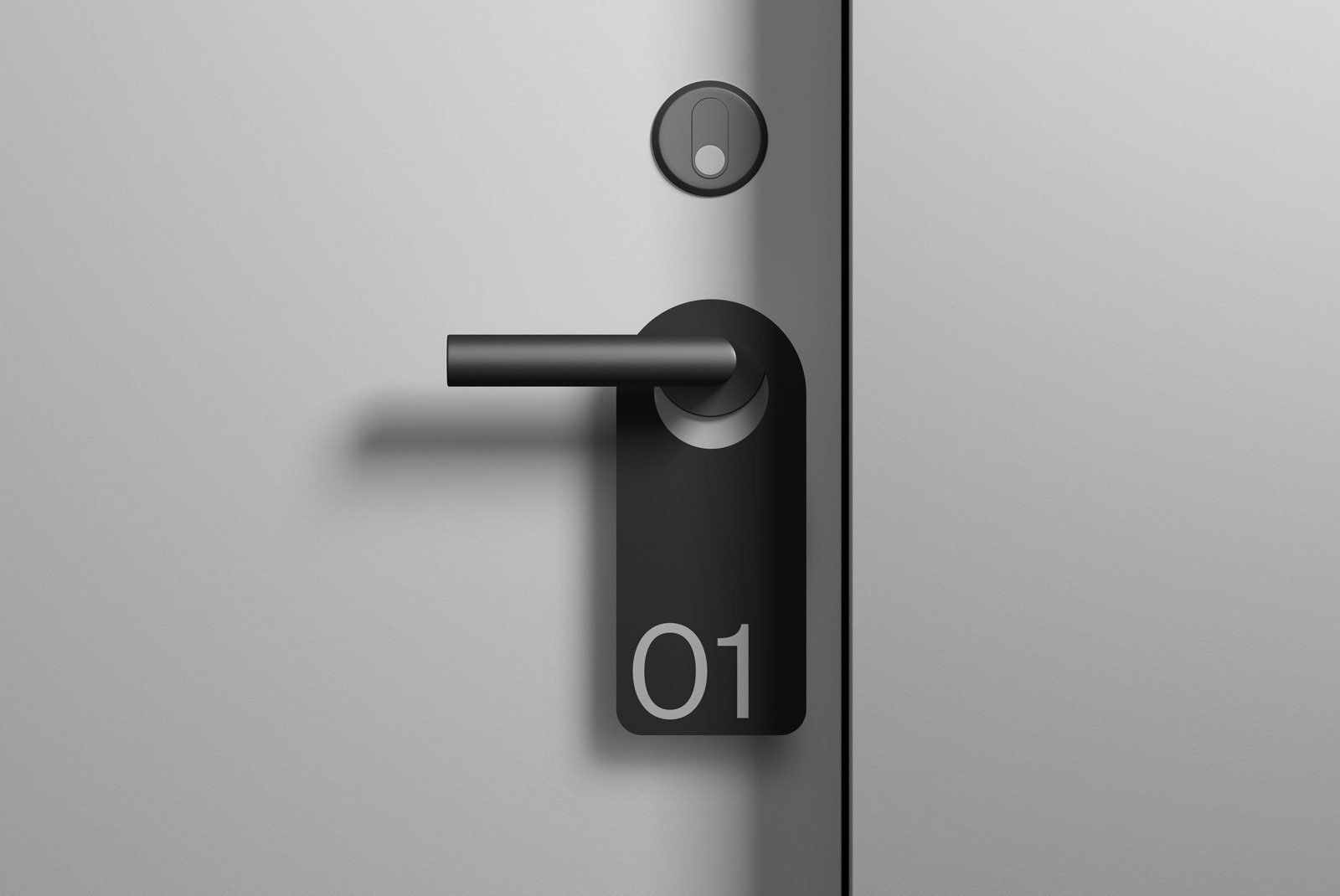 Minimalist door handle with a black tag labeled 01. Ideal for product mockups especially in the Packaging Mockups and Branding Mockups categories.