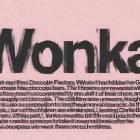Textured print mockup with bold text "Wonka" and blurred background text on pink paper. Ideal for showcasing typography, poster designs, and print materials.