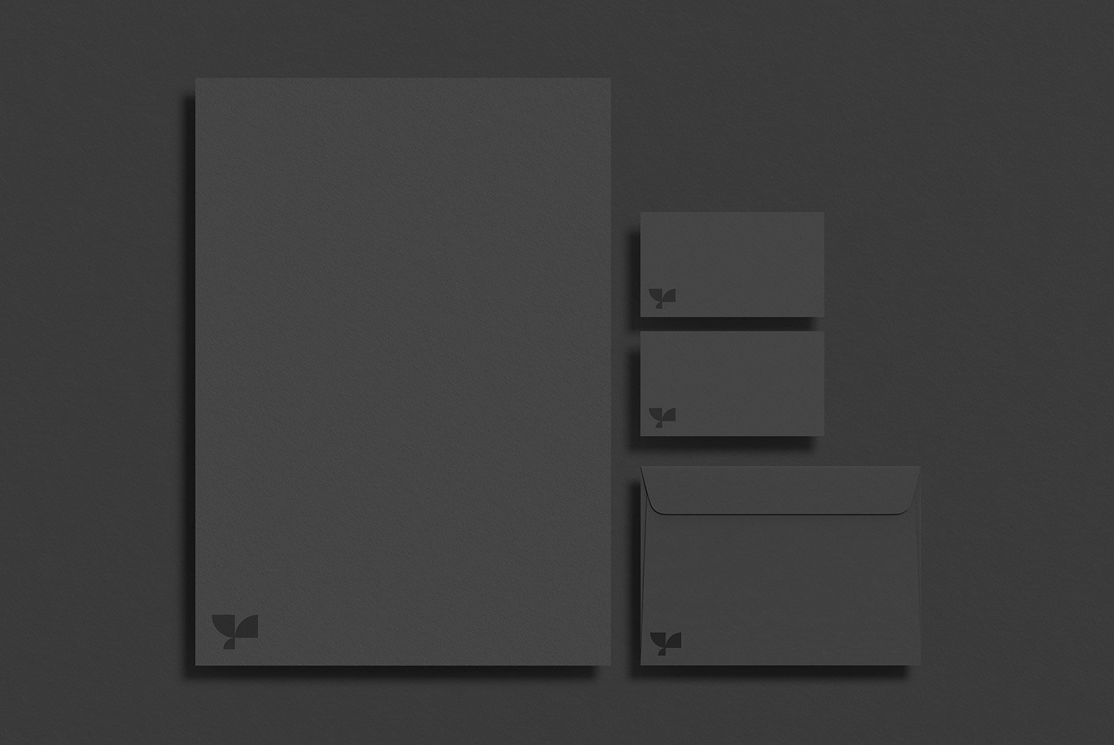 Dark stationery mockup set with letterhead envelope and business cards for print mockups. Ideal for graphic designers at a digital asset store for branding projects.