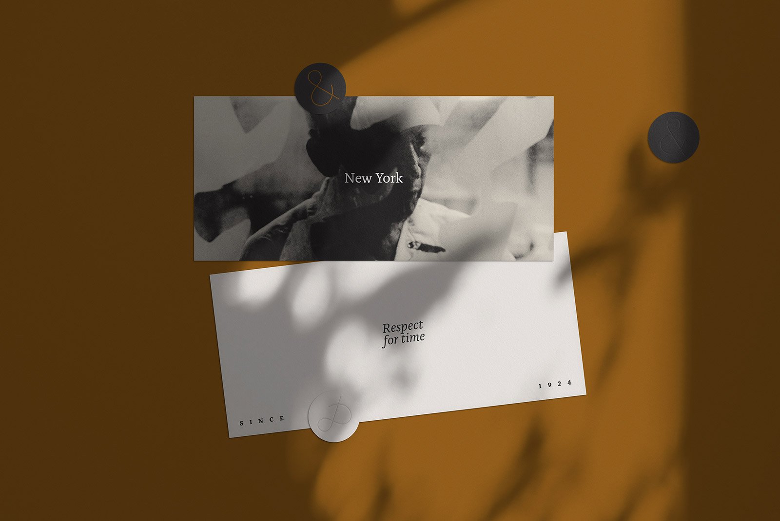 Two print mockup cards pinned against a brown background, one with New York text and a black-and-white image, the other with Respect for time text.