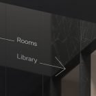 Modern sign directing to rooms left and library right in black marble wall setting. Ideal for print mockups packaging mockups interior design graphics.