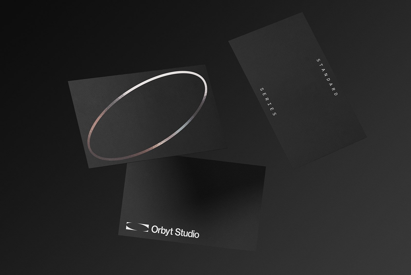 Floating black business cards mockup against a dark background perfect for showcasing print designs to graphic designers in need of professional mockups.