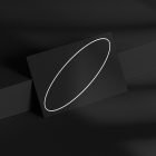Minimalistic business card design mockup with a white oval outline on a black background. Ideal for graphic designers and branding presentations.