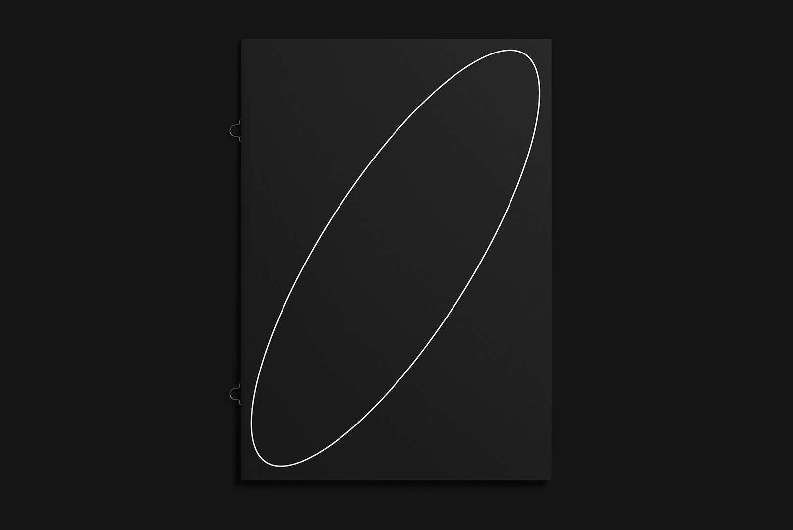 Minimalist black booklet mockup with a white ellipse design perfect for showcasing print designs graphic design portfolios and marketing materials.