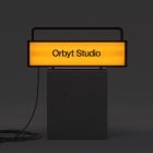 Illuminated yellow sign mockup with Orbyt Studio text on black pedestal. Perfect for billboard mockup, graphic design, marketing presentations, digital assets.