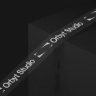 Packaging mockup featuring custom branded tape with Orbyt Studio logo on a black box. Ideal for graphic designers, print mockups, and packaging designs.