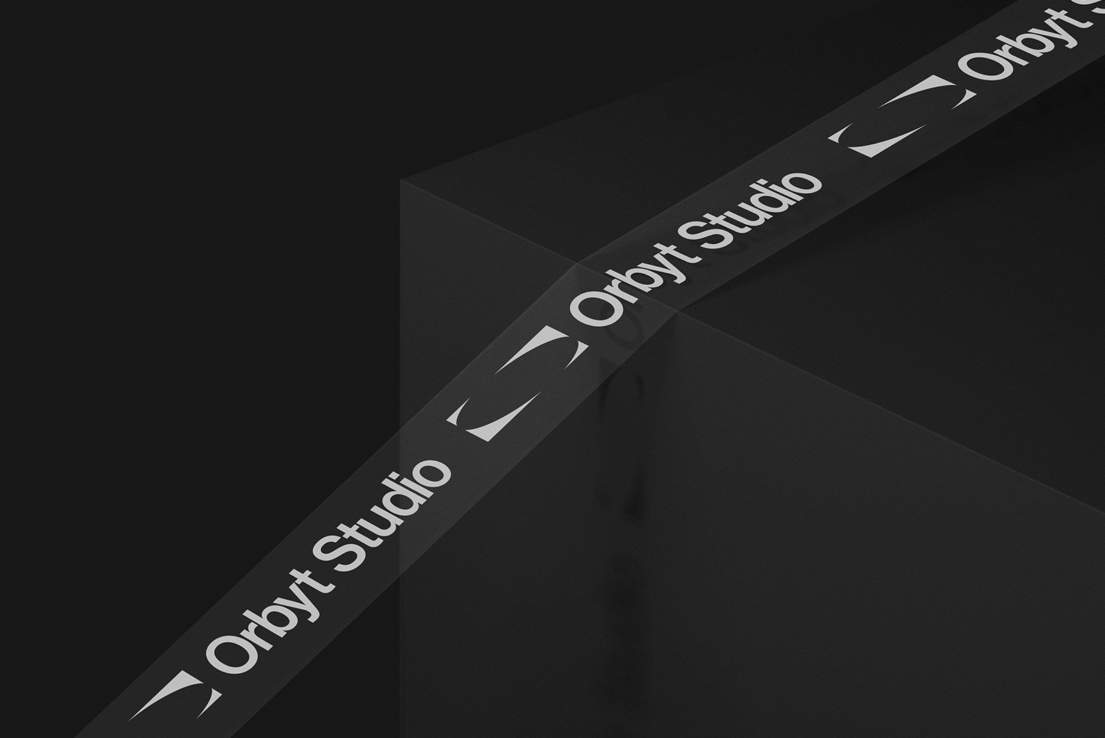 Packaging mockup featuring custom branded tape with Orbyt Studio logo on a black box. Ideal for graphic designers, print mockups, and packaging designs.