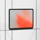 Tablet with red and gray abstract screen displayed on glass shelf with minimal metal frame background tech mockups digital asset graphic design resources