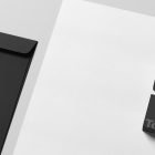 Black business card mockup with an envelope on a white background suitable for graphic designers Print mockup professional branding stationery template