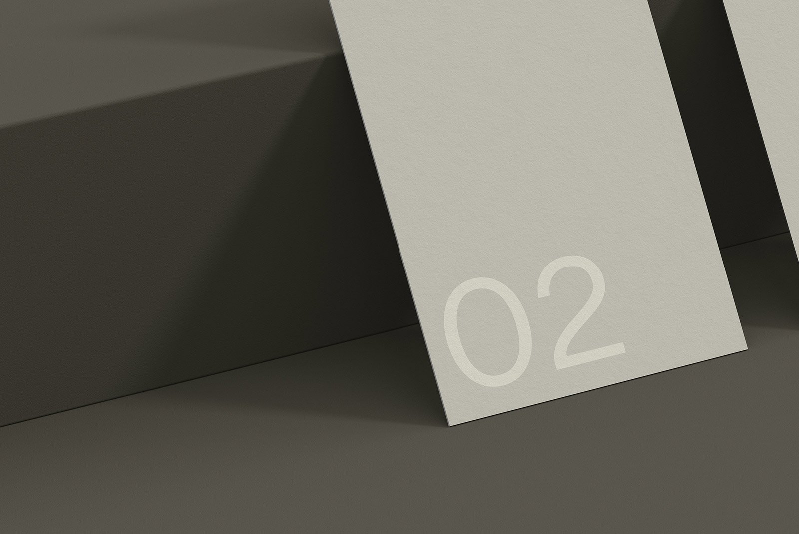 Minimalist print mockup with paper card showing number 02 placed on a dark surface. Ideal for graphic designers to showcase design assets for print.