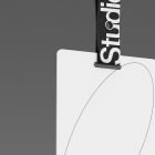 Label mockup with black fabric strap featuring partial studio text. Ideal for print and packaging mockups. High-resolution PSD for graphic designers.