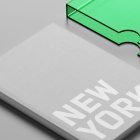 Book cover packaging mockup featuring a minimalist design with the text New York and a green transparent slipcase; ideal for graphic designers.