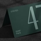 Hotel room number card mockup in dark green with text ANNO 1824 and Hotel Paris Large number 47 Perfect for print and design presentation Graphic design resource