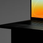 Close-up of a laptop with orange and blue screen suitable for tech mockups web mockups and graphic design resources for designers.