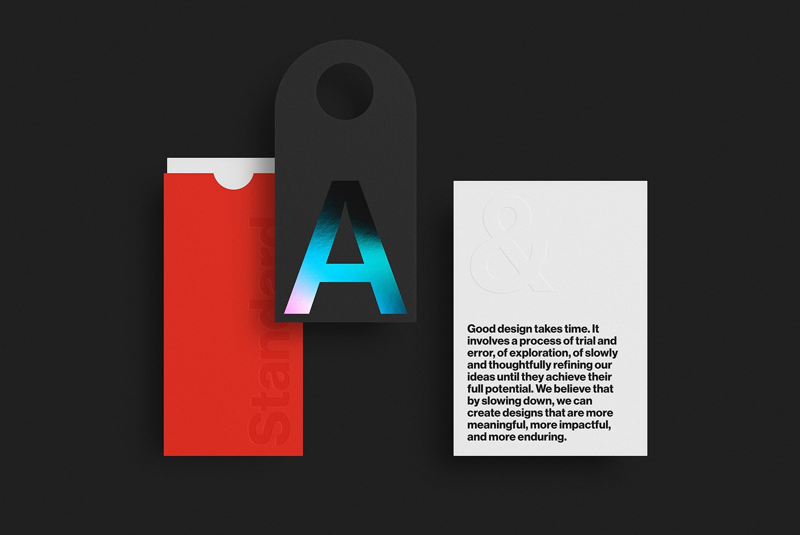 Minimalist design mockup featuring a red sleeve, black tag with iridescent A and a white card with embossed text. Ideal for packaging mockups and graphic design.