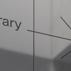 Directional sign pointing to a library in a modern style showcasing typography design suitable for graphics and print mockup references for graphic designers.