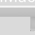 Close-up of a sleek silver iMac desktop computer screen with a partial view of the stand. Ideal for tech mockups and digital design projects.