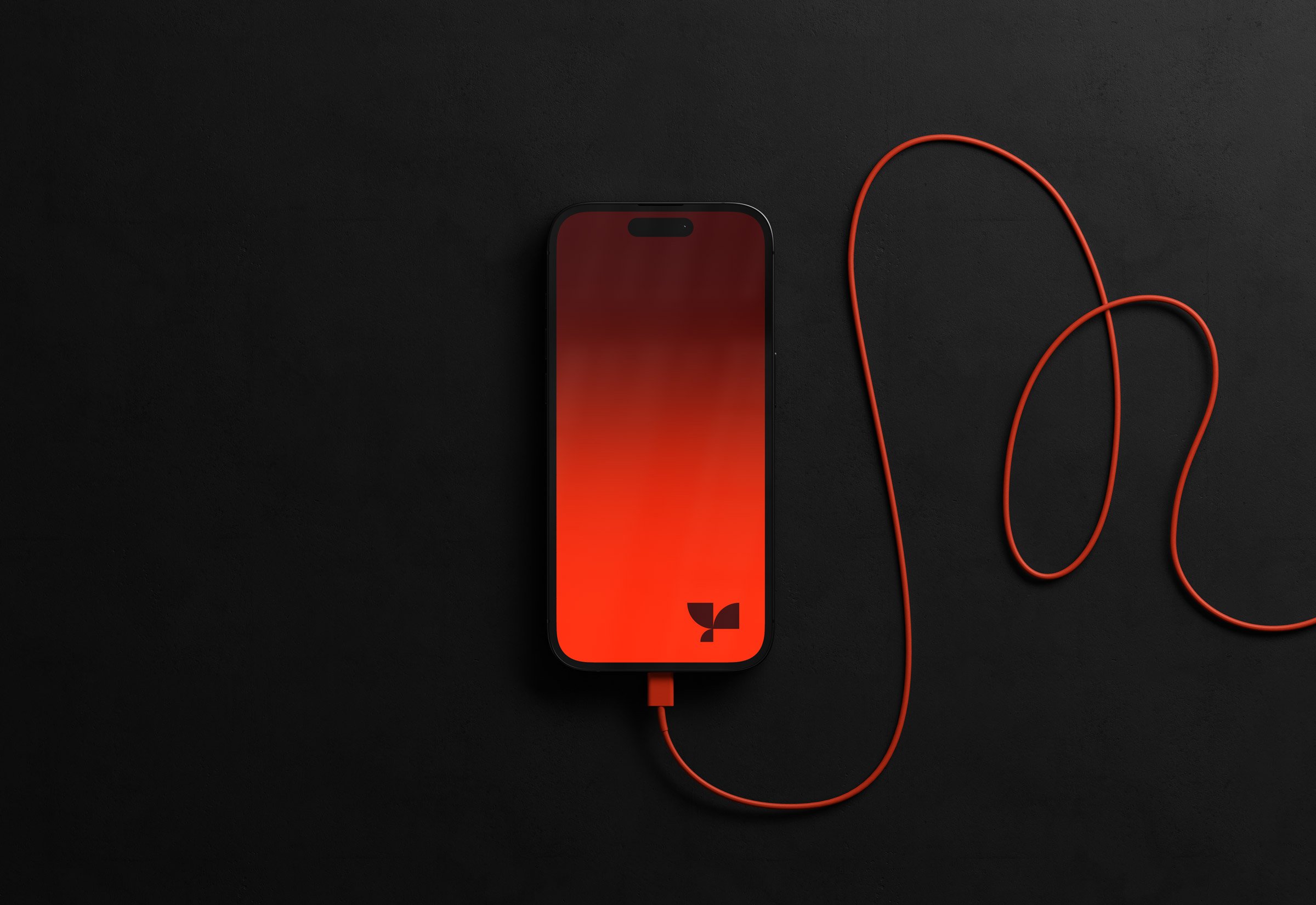 Smartphone tech mockup featuring a black phone with a red gradient screen and red charging cable on a dark background perfect for graphic designers