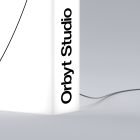 Minimalist tech mockup featuring a white product with text Orbyt Studio and a sleek curved wire on a light grey background suitable for graphic designers.