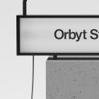This image features a rectangular billboard mockup with black frame mounted on a concrete base ideal for graphic design showcasing or storefront mockup presentations.