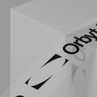 Packaging mockup featuring a minimalistic box and branded tape reading Orbyt Studio perfect for graphic designers seeking modern packaging design assets.