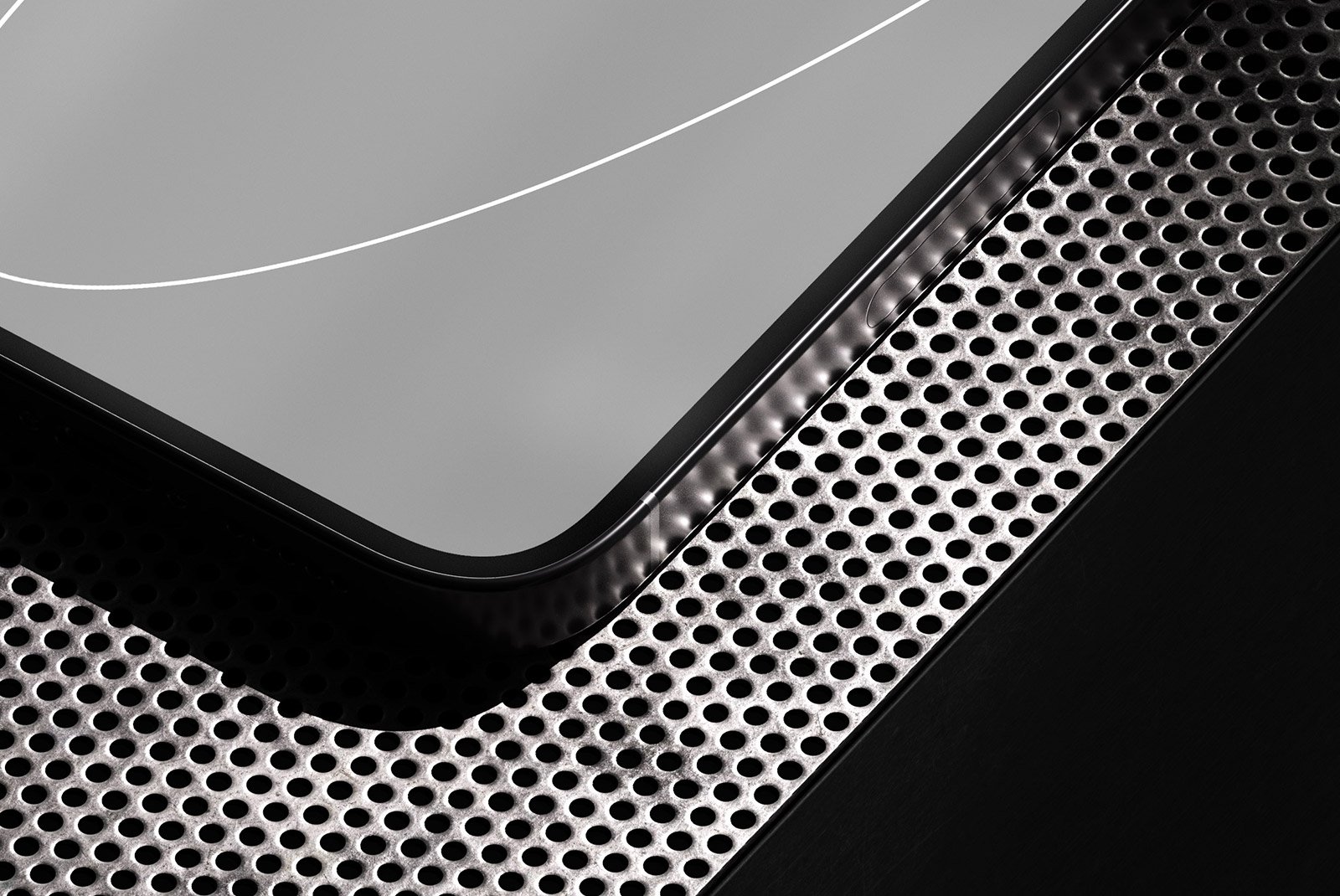 Close-up of a sleek tech device on a perforated metal surface suitable for tech mockups and digital assets for graphic designers.