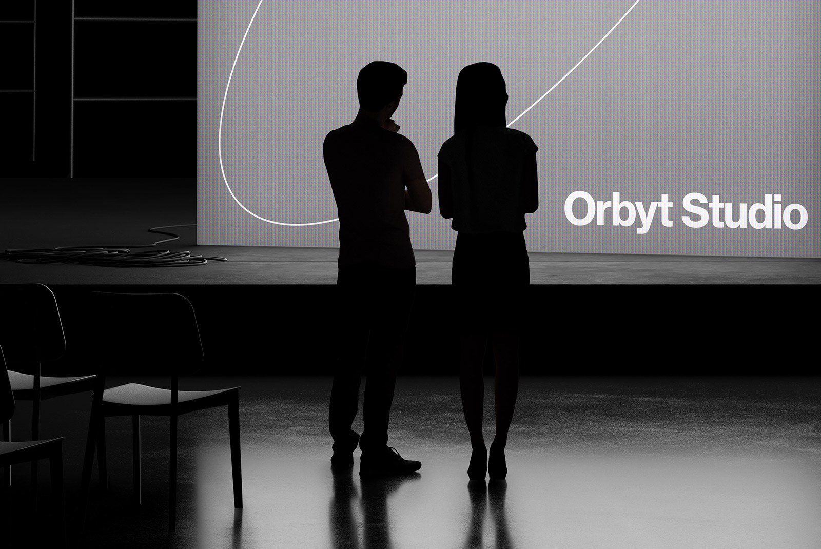 Silhouettes of two people standing in front of a large screen displaying Orbyt Studio. Ideal for print mockups, tech mockups, and graphic design presentations.