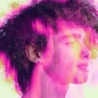 Male profile portrait with colorful neon light effects ideal for Photoshop effects graphics and digital designs. Perfect for graphic designers seeking unique assets