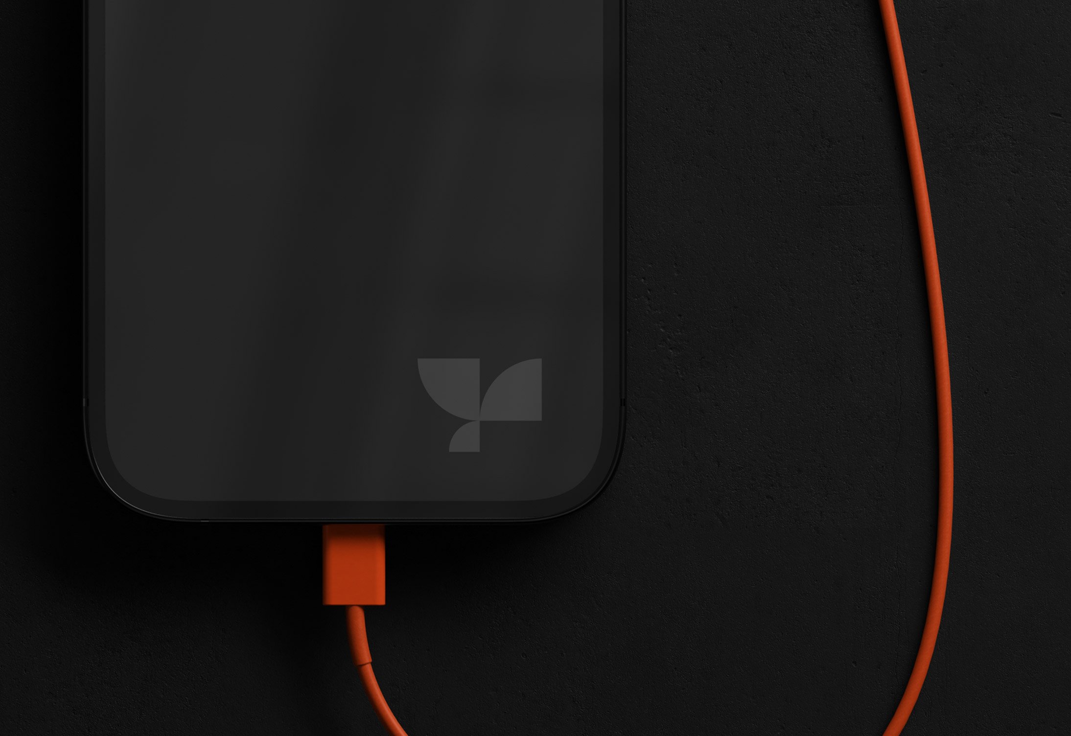 Mockup of a smartphone with an orange charging cable on a dark background. Ideal for tech mockups, digital asset store for graphic designers.