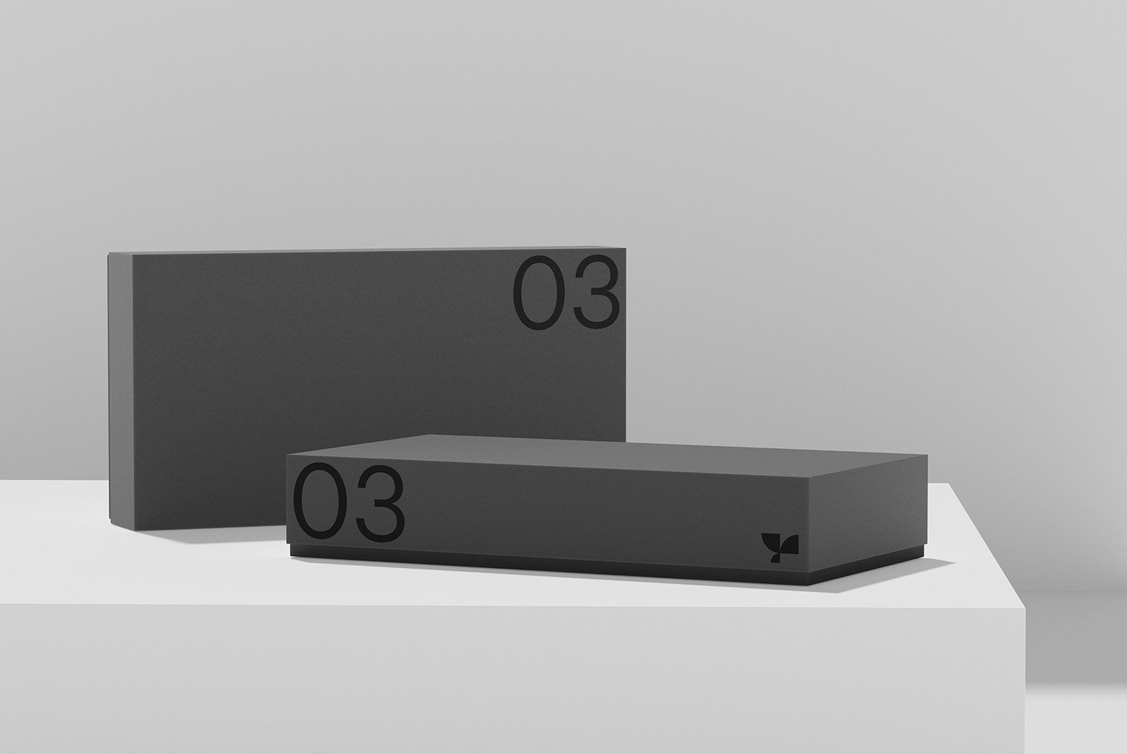 Black minimalistic rectangular packaging mockup on gray background ideal for product design branding and presentation. Keywords: packaging mockup, graphic design.
