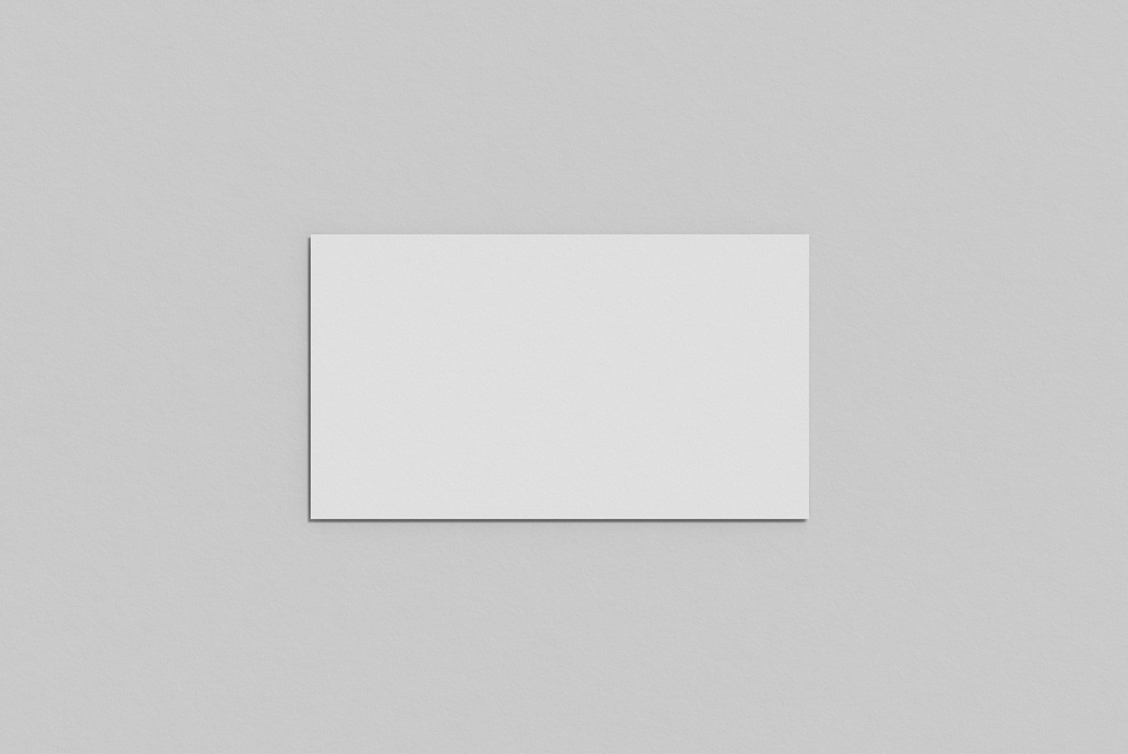 Blank A4 paper mockup on a grey background ideal for print design, stationery templates, and graphic design projects. Download this print mockup for designers.
