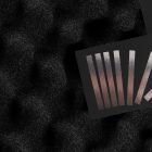 Metallic foil print mockup showcasing reflective silver and bronze bands on a textured black background ideal for graphic designers and print projects.