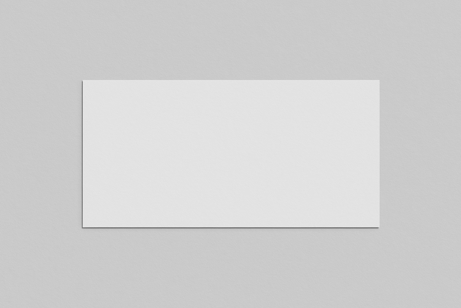 Blank paper mockup on a light gray background ideal for print mockups. Perfect for graphic designers to showcase designs or artwork in a minimalist style.