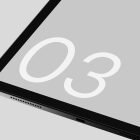 Close-up of tablet screen displaying number 03 on light grey background. Digital asset featured in tech mockups, perfect for graphic designers and web projects.